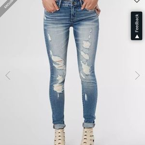 Buckle black skinny jeans